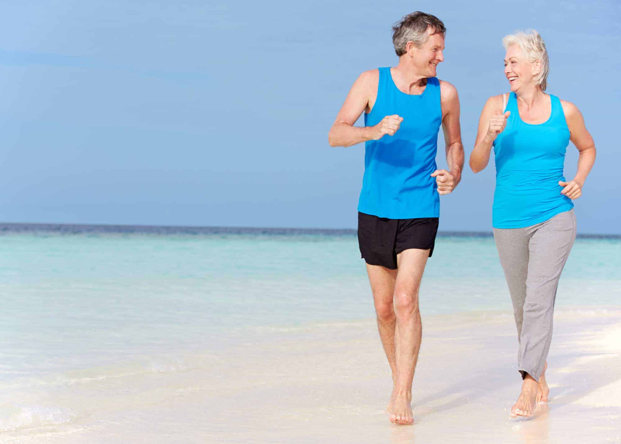 couple running on the beach