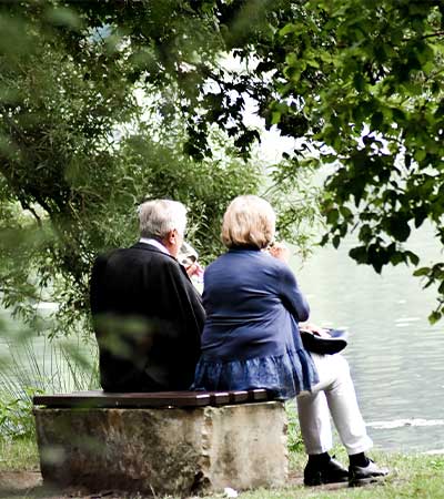 couple sitting by the water